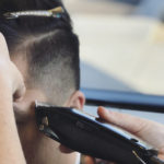 man getting a haircut at salon