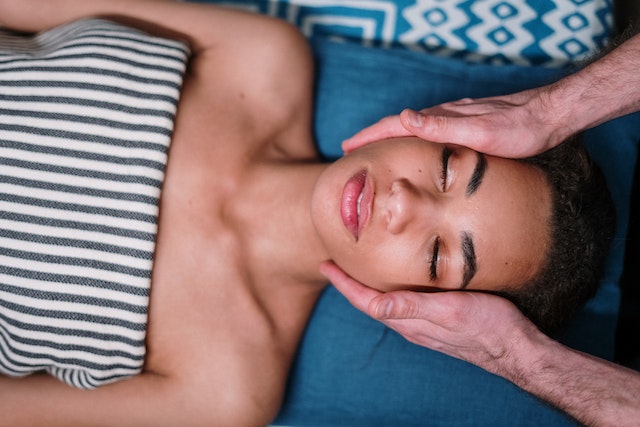 Woman lying down with eyes closed at med spa